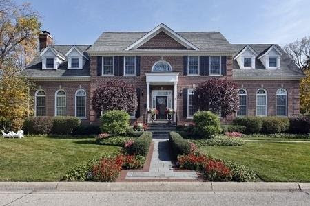 Large brick house with formal landscaping