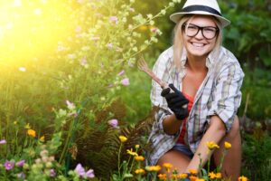 smiling woman gardening on a sunny day